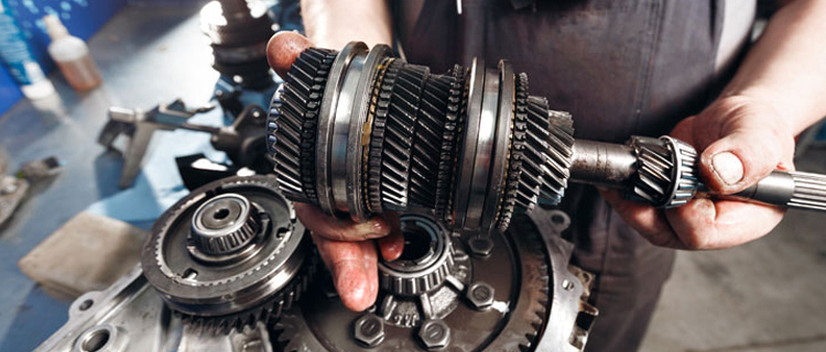 Mechanic holding transmission gears